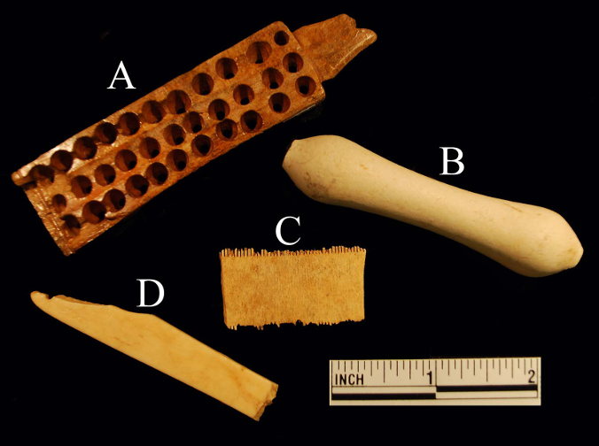 Artifacts from Ferry Farm related to eighteenth-century hair care.  A) A woman’s bone hair brush, used on natural (not wig) hair.  B) An earthenware wig hair curler, made c. 1740-1780.  C)  A bone grooming or “lice” comb.  D)  A bone razor guard, used by men to shave their facial hair and to shave the head to accommodate a tight-fitting peruke.